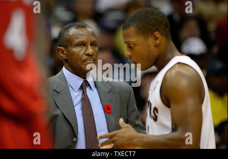 Toronto Raptors head coach Dwane Casey (L) watches guard Kyle Lowry in the second half of their game against the Atlanta Hawks at Philips Arena in Atlanta, November 1, 2013. Atlanta won102-95. UPI/David Tulis Stock Photo