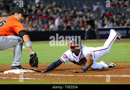 Atlanta Braves' B.J. Upton (R) is held on first by by Miami Marlins first baseman Garrett Jones (46) in the sixth inning at Turner Field in Atlanta, April 21, 2013. UPI/David Tulis Stock Photo