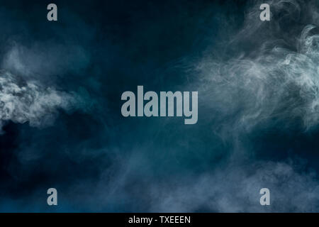 white smoke isolated in color blue and green background Stock Photo