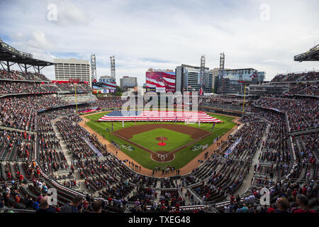 The U.S. flag is presented prior to National League Division Series Game 4 between the Atlanta Braves and the Los Angeles Dodgers at Suntrust Park in Atlanta, October 8, 2018. Photo by Paul Abell/UPI Stock Photo