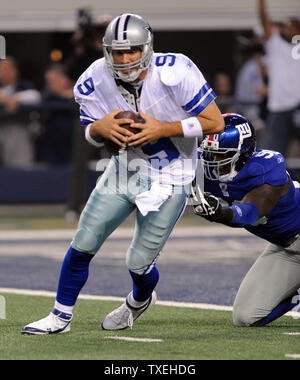 Dallas Cowboys Tony Romo gets sacked for a safety by the New York Giants Jason Pierre-Paul during the first half at Cowboys Stadium in Arlington, Texas on December 11, 2011.  UPI/Ian Halperin Stock Photo
