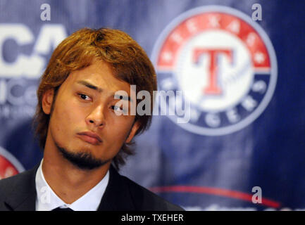 New Texas Rangers pitcher Yu Darvish talks to the media during a press conference at The Ballpark in Arlington on January 20, 2012 in Arlington, Texas.  Darvish signed a contract worth $60 million over six years.   The two-time MVP of Japan's Pacific League had a 93-38 record with a 1.99 ERA in 167 games the past seven seasons. The 25-year-old right-hander was a five-time All-Star in Japan.   UPI/Ian Halperin Stock Photo