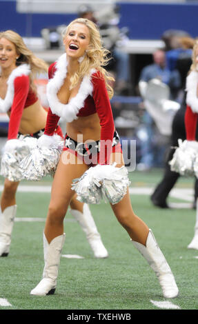 Dallas Cowboys Cheerleaders perform their annual Christmas themed halftime  show during the Cowboys and Green Bay Packers game at AT&T Stadium in  Arlington, Texas on December 15, 2013. The Packers rallied from