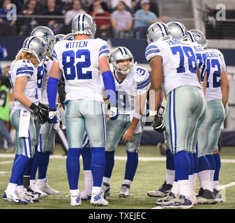 Dallas Cowboys Tony Romo calls a play in the huddle as his team plays the Detroit Lions in a NFL Wild Card Game at AT&T Stadium in Arlington, Texas on January 4, 2015.  The Cowboys won 24-20 and advance to face the Green Bay Packers next weekend.  Photo by Ian Halperin/UPI Stock Photo