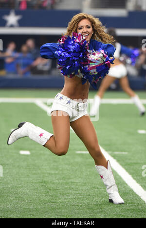 Dallas Cowboys Cheerleaders perform during the Cowboys and New England Patriots game AT&T Stadium on October 11, 2015 in Arlington, Texas. Photo by Ian Halperin/UPI Stock Photo