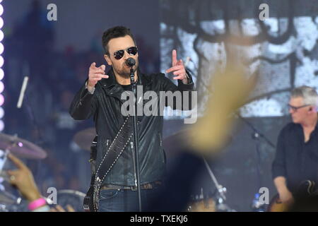 Country music star Eric Church performs during halftime of the Dallas  Cowboys and Washington Redskins game at AT&T Stadium on November 24, 2016  in Arlington, Texas. The performance kicked off The Salvation