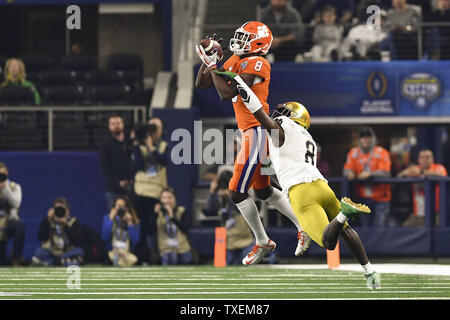 Clemson Tigers wide receiver Justyn Ross (8) catches a 52 yard touchdown pass against the Notre Dame Fighting Irish cornerback Donte Vaughn (8) during the first half of the College Football Playoff Semifinal at the Goodyear Cotton Bowl Classic at AT&T Stadium in Arlington, Texas on December 29, 2018. Photo by Shane Roper/UPI Stock Photo