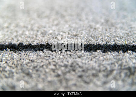 Perspective of grey carpet with black lines background texture, close up, gray textile texture, fluffy rug background, dark wool fabric texture, grey Stock Photo