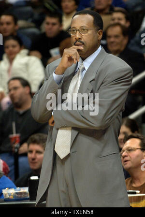 Atlanta Hawks coach Mike Woodson watches his team play against the defending NBA champions, the visiting San Antonio Spurs, in Atlanta's Philips Arena December 10, 2005. The Hawks defeated the Spurs 94 - 84. (UPI Photo/John Dickerson) Stock Photo