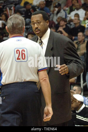 Atlanta Hawks coach Mike Woodson (R) has a discussion with an official in the first half in Atlanta's Philips Arena December 27, 2005. The Bobcats defeated the Hawks 93-90. (UPI Photo/John Dickerson) Stock Photo