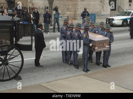 The casket containing the body of Coretta Scott King, the widow of Martin Luther King Jr., is carried from a horse-drawn carriage by Georgia Highway Patrolmen to the Georgia State Capitol in Atlanta February 4, 2006, where it will lie in state throughout the day for viewing by the public.  Ms. King, 78, died in a clinic in Mexico January 30, 2006. Her funeral will be February 6, 2006. (UPI Photo/John Dickerson) Stock Photo