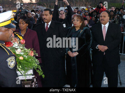 The children of Coretta Scott King, (L-R) Rev. Bernice King, Dexter King, Yolanda King and Martin Luther King III watch as their mother's casket is carried from the New Birth Missionary Baptist Church in Lithonia, Ga., after her funeral service February 7, 2006. Coretta Scott King was the wife of Dr. Martin Luther King Jr.  (UPI Photo/Byron Small) Stock Photo