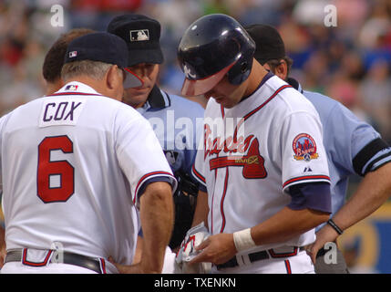 Atlanta Braves right fielder Jeff Francoeur talks with Braves manager Bobby Cox in the second inning after Francoeur was hit on his hand by a pitch June 7, 2006, in Atlanta's Turner Field. The Nationals defeated the Braves 5-3. (UPI Photo/John Dickerson) Stock Photo