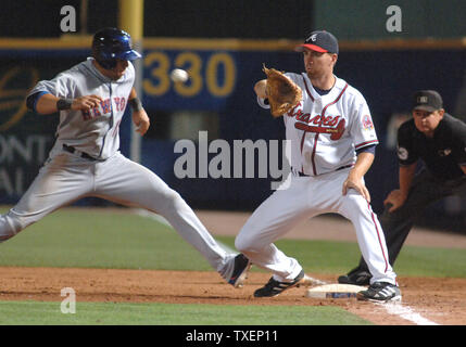 Florida Marlins Carlos Beltrans gets back to first safely on a ninth-inning pick-off attempt to Atlanta Braves first baseman Adam LaRoche July 28, 2006, in Atlanta's Turner Field. The Mets defeated the Braves 6-4.  (UPI Photo/John Dickerson) Stock Photo