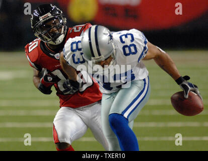 Dallas Cowboys wide receiver Terry Glenn (83) pushes away from Atlanta  Falcons corner back Allen Rossum (20) after catching a pass in the fourth  quarter at the Georgia Dome in Atlanta, December 16, 2006. The Cowboys  defeated the Falcons 38-28. (UPI