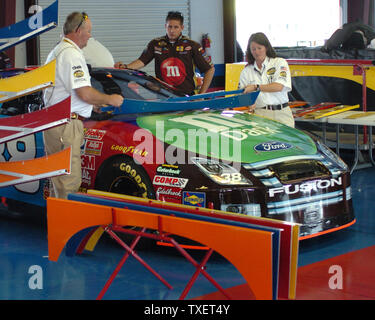 NASCAR officials use templates to check the exterior measurements of David Gilliland's M&M's Ford during pre-qualifying inspection for the Aaron's 499 NASCAR Nextel Cup series race at Talladega Superspeedway in Talladega, Alabama on April 28, 2007. (UPI Photo/John Dickerson) Stock Photo