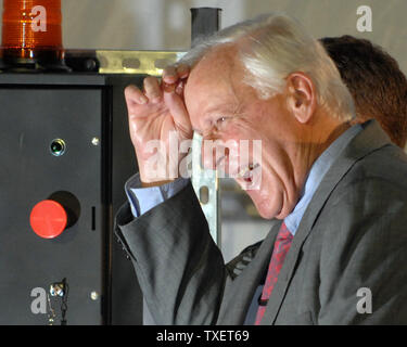 Delta Air Lines CEO Gerald Grinstein laughs as he prepares to unveil a airplane painted with new branding after he announced that Delta has officially emerged from Chapter 11 during an employee gathering where new corporate branding was also introduced in Atlanta on April 30, 2007. (UPI Photo/John Dickerson) Stock Photo