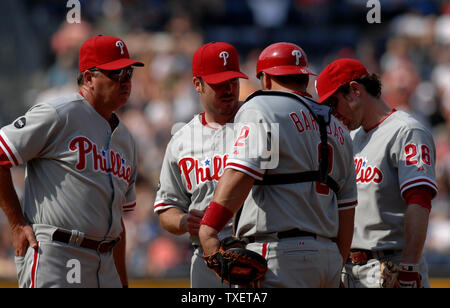 Atlanta Braves starting pitcher Kyle Davies earned a meeting on the  pitchers mound with first baseman Adam LaRoche (R) and catcher Brian McCann  (L) after he walked the first two New York