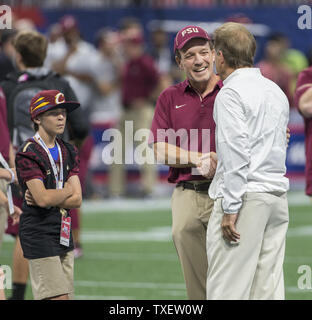Florida State head coach Jimbo Fisher shakes hands with Alabama head coach Nick Saban as Fisher's son, Ethan Fisher, left, look on before the Chick-fil-A Kickoff game at the new Mercedes-Benz Stadium in Atlanta, Georgia on September 2, 2017. Photo by Mark Wallheiser/UPI Stock Photo