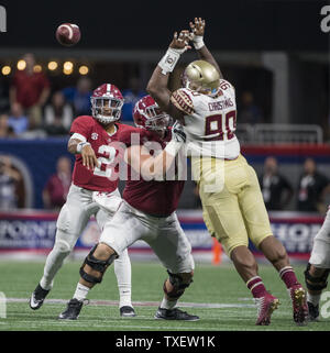 Florida State defensive lineman Demarcus Christmas (90)  tries to block the pass of Alabama quarterback Jalen Hurts (2) in the second half of the Chick-fil-A Kickoff game at the new Mercedes-Benz Stadium in Atlanta, Georgia on September 2, 2017. Alabama defeated Florida State 24-7.  Photo by Mark Wallheiser/UPI Stock Photo