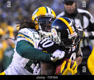 Green Bay Packers safety Atari Bigby (20) during player introduction of an  NFL football game between the Green Bay Packers and the Detroit Lions  Sunday, Oct. 18, 2009, in Green Bay, Wis.