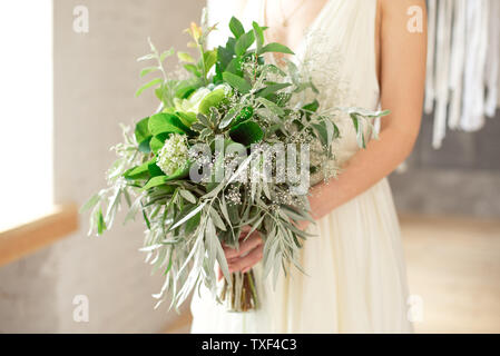 Slightly disheveled fresh and airy bridal bouquet with a grinn ball