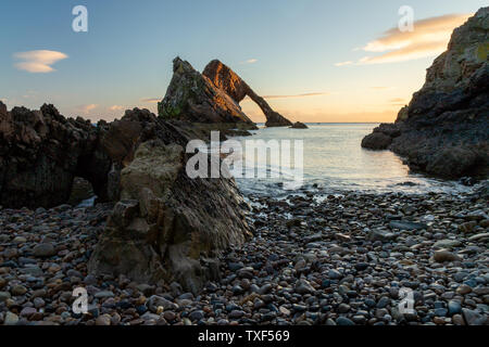 Sunrise light and colours by the shores of Portknockie town near Bow Fiddle Rock formation. Scottish Highlands, United Kingdom, Europe. Stock Photo