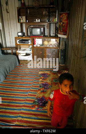 A young boy, whose family is squatting near a major American military base in Baghdad, boy stands in his living quarters  on April 1, 2004. The families here are facing an April 4 eviction. To go with story BC-IRAQ-SQUATTERS    (UPI Photo/Mitch Prothero) Stock Photo