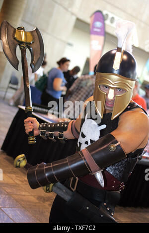 David Santiago (L) as Ares, God of War, and Garrett Gird, as Thor, wait  with others to be judged for the costume contest at the 11th annual Comic  Con in Baltimore on