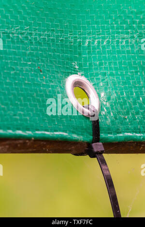 Plastic stripe pies for banner fixing as canopy Stock Photo