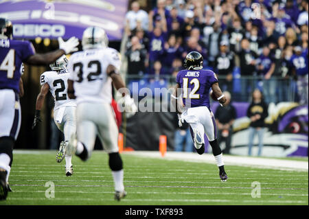 Baltimore Ravens wide receiver Jacoby Jones signs an autograph as he holds  a turkey leg after the Ravens defeated the Pittsburgh Steelers 22-20 on  Thanksgiving day at M&T Bank Stadium in Baltimore