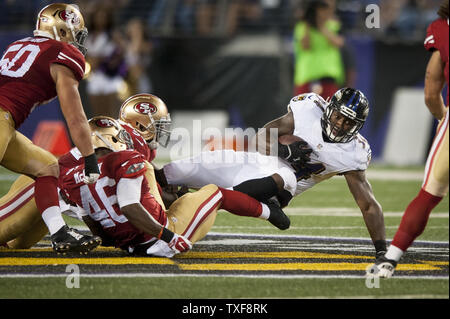 Baltimore Ravens running back Lorenzo Taliaferro (34) gains 11 yards in the  fourth quarter against the Pittsburgh Steelers at Heinz Field in Pittsburgh  on October 1, 2015. The Ravens went on to