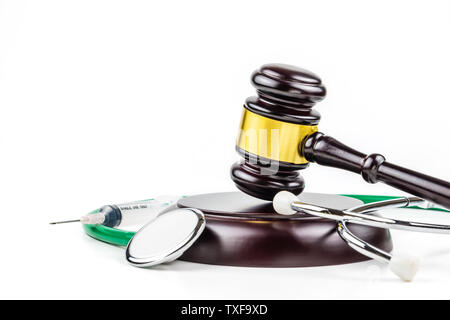 A photo of Stethoscope and gavel on white background Stock Photo