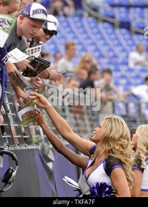 Baltimore Ravens cheerleaders sign autographs before their preseason football game against the Washington Redskins at M&T Bank Stadium in Baltimore, August 29, 2015. Photo by David Tulis/UPI Stock Photo