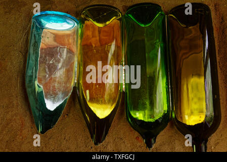 A creative use for colourful old wine bottles Stock Photo