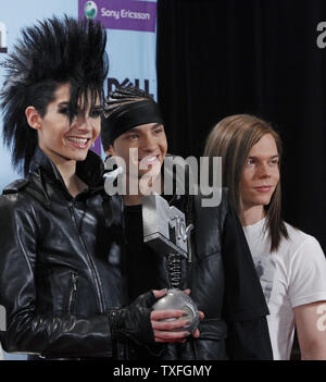 Bill Kaulitz (L), Tom Kaulitz (C) and Georg Listing of Tokio Hotel hold their award for Best Band backstage after the MTV Europe Music Awards in Berlin, Germany on November 5, 2009.   (UPI Photo/David Silpa) Stock Photo