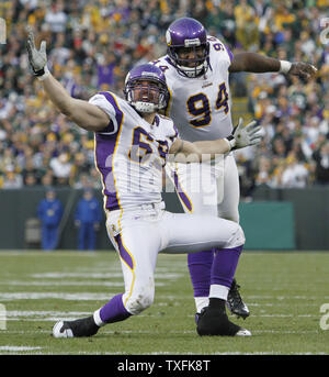 Minnesota Vikings defensive tackle Pat Williams looks at a replay