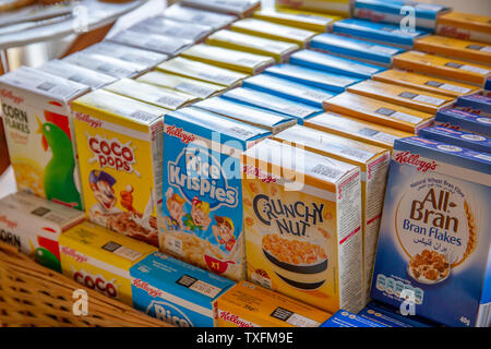 KETTERING, ENGLAND - JUNE 24 2019: Kellogg's single serve cereal variety boxes of Cornflakes, Coco pops, Rice Krispies, Crunchy Nut and All-Bran Stock Photo