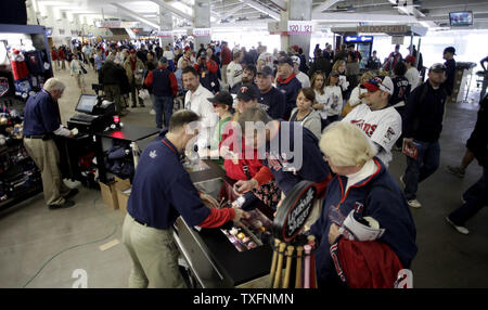Fans shop for souvenirs on the main concourse on Opening Day at Target Field in Minneapolis on April 12, 2010. The new open-air ballpark made its official debut Monday as the Minnesota Twins beat the Boston Red Sox 5-2 in the game.    UPI/Brian Kersey Stock Photo