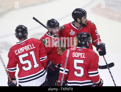 Chicago Blackhawks defenseman Brian Campbell (L-R), Kris Versteeg, Dustin Byfuglien and Brent Sopel celebrate Versteeg's goal during the first period of game 5 of the 2010 Stanley Cup Final against the Philadelphia Flyers at the United Center in Chicago on June 6, 2010.     UPI/Brian Kersey Stock Photo