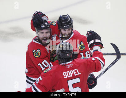 Chicago Blackhawks left wing Patrick Sharp (L), defenseman Brent Sopel (C) and left wing Andrew Ladd celebrate Sharp's goal during the third period of game 5 of the 2010 Stanley Cup Final against the Philadelphia Flyers at the United Center in Chicago on June 6, 2010. The Blackhawks won 7-4 and lead the best of seven series 3-2.     UPI/Brian Kersey Stock Photo