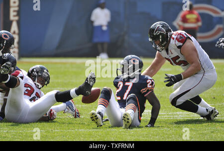 Atlanta Falcons running back Michael Turner (L) fumbles after being hit by Chicago Bears defensive back Major Wright (27) during the first quarter at Soldier Field on September 11, 2011 in Chicago.    UPI/Brian Kersey Stock Photo