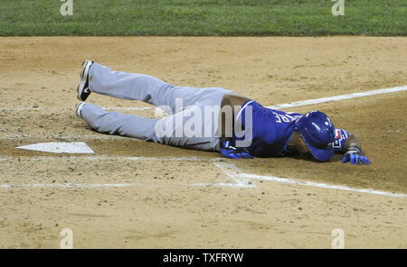 Texas Rangers third baseman Adrian Beltre lays on the ground after fouling a ball off of his leg during the fourth inning of game 3 of the American League Championship Series against the Texas Rangers at Comerica Park on October 11, 2011 in Detroit, Michigan.    UPI/Brian Kersey Stock Photo