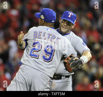 Texas Rangers third baseman Adrian Beltre (29) hugs first baseman Michael Young after defeating the St. Louis Cardinals in game 2 of the World Series at Busch Stadium on October 20, 2011 in St. Louis. The Rangers won 2-1 tying the series 1-1.      UPI/Brian Kersey Stock Photo