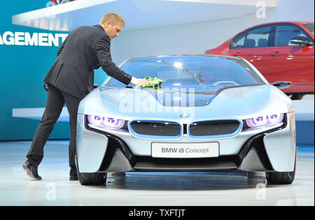 A worker cleans off the the BMW i8 concept at the 2012 North American International Auto Show on January 9, 2012 in Detroit.     UPI/Brian Kersey Stock Photo