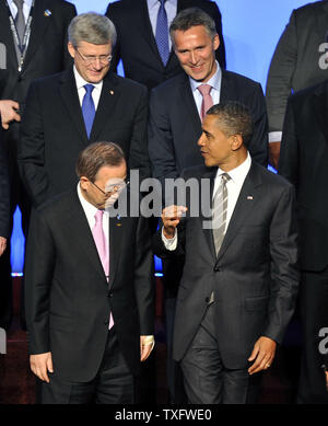 U.S. President Barack Obama (front right), talks with United Nations Secretary General Ban Ki-moon (front left), Canadian Prime Minister Stephen Harper (L) and Norwegian Prime Minister Jens Stoltenberg as they get ready for the International Security Assistance Force meeting on Afghanistan official photo at the 2012 NATO Summit on May 21, 2012 in Chicago.     UPI/Brian Kersey Stock Photo