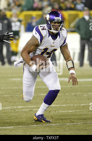 Dec. 24, 2011 - Landover, Maryland, U.S - Minnesota Vikings quarterback Joe  Webb (14) picks up a block from wide receiver Percy Harvin (12) during  Saturday afternoon's game against the Washington Redskins