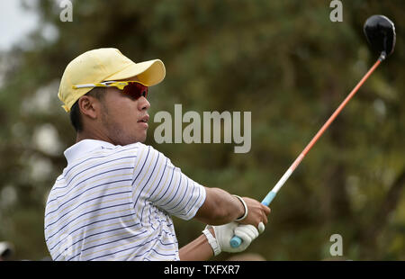 International Team member Hideki Matsuyama of Japan tees off on the 15th hole during the third round four-ball competition against the United States Team at the 2013 Presidents Cup at Muirfield Village Golf Club in Dublin, Ohio on October 5, 2013.     UPI/Brian Kersey Stock Photo