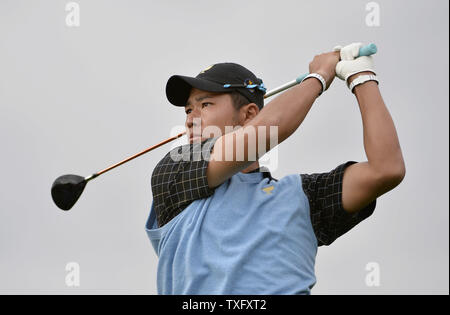 International Team member Hideki Matsuyama of Japan tees off on the first hole during the fifth round singles competition against the United States Team at the 2013 Presidents Cup at Muirfield Village Golf Club in Dublin, Ohio on October 6, 2013.     UPI/Brian Kersey Stock Photo