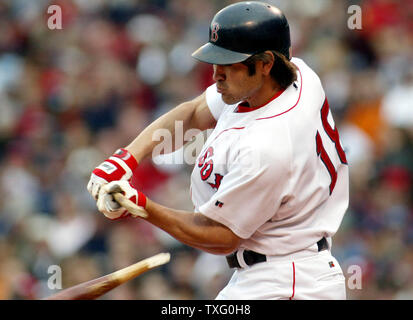 Johnny Damon, of the Boston Red Sox, breaks his bat on a fastball 